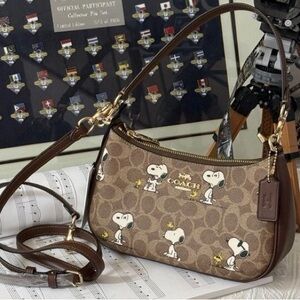 Coach X Peanuts Teri Shoulder Bag In Signature Canvas With Snoopy Print.